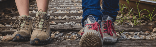 A runner changing into fresh socks to reduce moisture and friction during a long-distance race